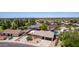 Aerial view of a residential area with a mix of single-Gathering homes, landscaping, and a community pool at 846 N 81St St, Mesa, AZ 85207