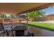 Relaxing covered backyard patio with outdoor grill and manicured artificial turf at 846 N 81St St, Mesa, AZ 85207