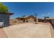Backyard with concrete court, stucco walls, and covered patio offering a versatile outdoor space at 846 N 81St St, Mesa, AZ 85207