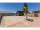 Backyard featuring a basketball court, shed, and block wall fence offering recreational space and privacy at 846 N 81St St, Mesa, AZ 85207