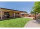 Beautiful backyard showcasing covered patio, artificial turf, outdoor kitchen, and BBQ area at 846 N 81St St, Mesa, AZ 85207