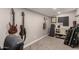 Finished basement featuring guitars hung on the wall and a cabinet in the corner, perfect for music lovers at 846 N 81St St, Mesa, AZ 85207
