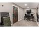 Basement features a painted door, a desk, and a guitar, all illuminated by recessed lighting at 846 N 81St St, Mesa, AZ 85207