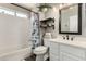 Bathroom with white vanity, framed mirror, and a shower-tub combination at 846 N 81St St, Mesa, AZ 85207