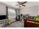 Bedroom with a ceiling fan, a large arched window, and playful decorations at 846 N 81St St, Mesa, AZ 85207