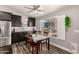 Charming dining area with dark wood cabinets, a window with shutters, and a patio view at 846 N 81St St, Mesa, AZ 85207