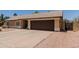 Single-story home with desert landscaping, a two-car garage, and a blue front door at 846 N 81St St, Mesa, AZ 85207