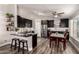 Modern kitchen features dark wood cabinets, stainless steel appliances, and an open dining area at 846 N 81St St, Mesa, AZ 85207