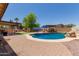 A beautiful backyard with a pool, patio, outdoor kitchen and grill for relaxing and entertaining at 846 N 81St St, Mesa, AZ 85207