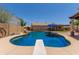 Backyard swimming pool featuring a diving board and a relaxing shaded patio area at 846 N 81St St, Mesa, AZ 85207