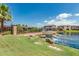 Scenic backyard with a pond, rock waterfall feature, and lush greenery at 919 W Yellowstone Way, Chandler, AZ 85248
