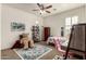 Neutral bedroom featuring a single bed, desk, storage, chair and a cozy rug at 919 W Yellowstone Way, Chandler, AZ 85248