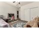 Neutral bedroom featuring a single bed, desk, chair, closet and a cozy rug at 919 W Yellowstone Way, Chandler, AZ 85248