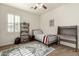 Neutral bedroom featuring a single bed, desk, storage, and a cozy rug at 919 W Yellowstone Way, Chandler, AZ 85248