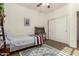 Neutral bedroom featuring a single bed, desk, storage, and a cozy rug at 919 W Yellowstone Way, Chandler, AZ 85248