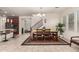 Bright dining room boasts tile floors, a chandelier, and a stairway to the second floor at 919 W Yellowstone Way, Chandler, AZ 85248