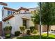 Charming two-story home featuring desert landscaping, a spacious driveway, and a two-car garage at 919 W Yellowstone Way, Chandler, AZ 85248