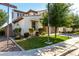 Charming two-story home featuring desert landscaping, a spacious driveway, and a two-car garage at 919 W Yellowstone Way, Chandler, AZ 85248