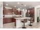 This kitchen boasts a center island with bar seating and modern stainless steel appliances at 919 W Yellowstone Way, Chandler, AZ 85248