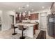 Eat-in kitchen features a center island with bar seating and stainless steel appliances at 919 W Yellowstone Way, Chandler, AZ 85248