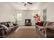 Spacious living room featuring vaulted ceilings, large sofas, ceiling fan, and neutral carpet at 919 W Yellowstone Way, Chandler, AZ 85248