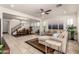 Open-concept living room and dining area features neutral colors, tile floors, and ample natural light at 919 W Yellowstone Way, Chandler, AZ 85248