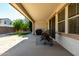 Covered patio with outdoor seating, barbecue, and well-maintained backyard at 919 W Yellowstone Way, Chandler, AZ 85248
