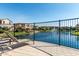 Relaxing lake view from the community pool area featuring a fountain and lounge chair at 919 W Yellowstone Way, Chandler, AZ 85248