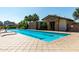 Community lap pool and recreation center with lounge chairs and professional landscaping at 919 W Yellowstone Way, Chandler, AZ 85248