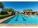 Community lap pool with swimming lane markers, ramada, lounge seating, and clear skies at 919 W Yellowstone Way, Chandler, AZ 85248