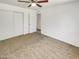 Bedroom featuring neutral carpet, ample closet space and a bright interior with fresh white paint at 920 E Garnet Ave, Mesa, AZ 85204