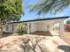 Charming single-story home with a covered carport and mature landscaping in a residential neighborhood at 920 E Garnet Ave, Mesa, AZ 85204