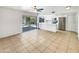 Open-concept kitchen features white cabinetry, stainless steel appliances and access to the backyard at 920 E Garnet Ave, Mesa, AZ 85204