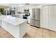 This bright kitchen features stainless steel appliances, and an island at 920 E Garnet Ave, Mesa, AZ 85204