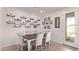 Inviting dining room with stylish decor, ample lighting, and seating for six at 932 W Capulin Trl, San Tan Valley, AZ 85140