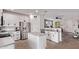 Modern kitchen with white cabinetry, stainless steel appliances, and granite countertops at 932 W Capulin Trl, San Tan Valley, AZ 85140