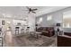 Open-concept living area features a breakfast bar and seamlessly connects to the kitchen at 932 W Capulin Trl, San Tan Valley, AZ 85140