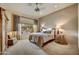 Serene bedroom with a cozy atmosphere and large windows overlooking beautiful desert landscaping at 9534 E Monument Dr, Scottsdale, AZ 85262