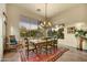 Dining room features a large window with desert landscape views and a chandelier at 9534 E Monument Dr, Scottsdale, AZ 85262
