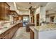 Kitchen with stainless steel appliances, tiled backsplash, and center island at 9534 E Monument Dr, Scottsdale, AZ 85262