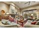 Open living room features a fireplace, built in shelving, and sliding glass doors at 9534 E Monument Dr, Scottsdale, AZ 85262