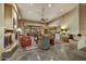 Spacious living room featuring a fireplace, tiled flooring, comfortable seating, and large windows with views to the outside at 9534 E Monument Dr, Scottsdale, AZ 85262
