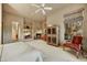 Spacious main bedroom featuring a fireplace, sitting area, and large windows at 9534 E Monument Dr, Scottsdale, AZ 85262