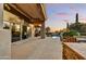 Inviting outdoor patio area with a view of the desert landscape and a pool at 9534 E Monument Dr, Scottsdale, AZ 85262