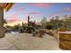Outdoor oasis with a pool, waterfall feature, and cozy seating area at 9534 E Monument Dr, Scottsdale, AZ 85262
