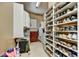 Spacious walk-in closet with custom shelving, offering abundant storage space for shoes and clothing at 9534 E Monument Dr, Scottsdale, AZ 85262