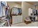 Well-organized walk-in closet with ample storage and custom shelving at 9534 E Monument Dr, Scottsdale, AZ 85262