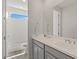 Bathroom featuring a clean, modern sink and vanity, and a view of bright natural light from the shower at 10144 E Toledo Ave, Mesa, AZ 85212