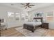 Cozy bedroom featuring a large bed, ample natural light, and neutral decor at 10144 E Toledo Ave, Mesa, AZ 85212