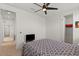 Bright bedroom with a patterned bedspread, and a comfortable living space at 10144 E Toledo Ave, Mesa, AZ 85212